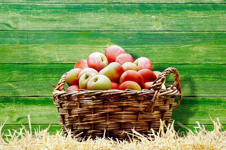 Fresh apples in a wicker basket at Diamond Creek Shopping, shopping local in Australia.