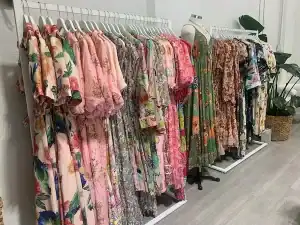 Image of colorful floral and patterned dresses on display at Grace's Closet, Diamond Creek Shopping.