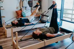 People practicing Pilates with resistance bands at Hurstbridge Pilates & Yoga studio.