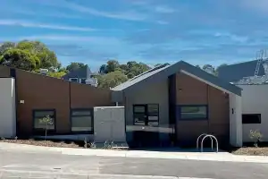 Modern commercial building at Launchpad Diamond Creek shopping center.