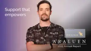 Man holding report with "Support that empowers" text in the background.