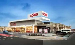 Bright exterior of Coles Supermarket at Diamond Creek Shopping with parking area.