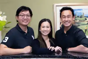 Group of smiling staff members at Diamond Creek Shopping Centre reception.