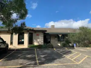 Exterior view of Diamond Valley Clinic in Diamond Creek Shopping center, accessible parking availabl.