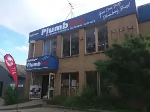 Exterior view of Rainbow Plumbtec store at Diamond Creek Shopping Centre, showcasing plumbing suppli.