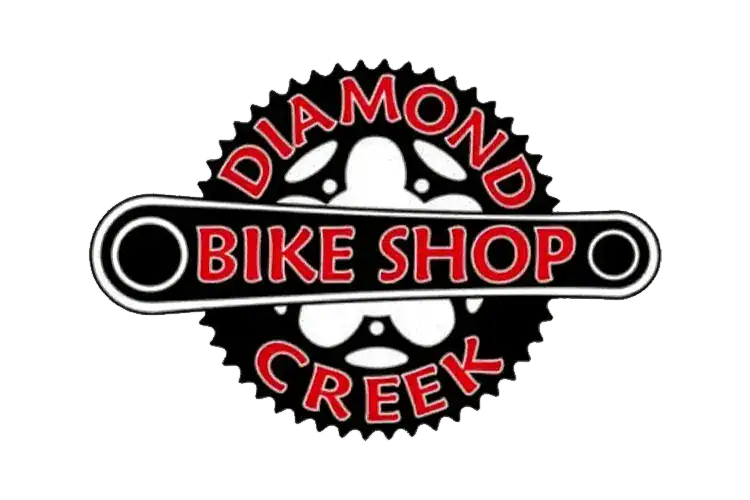 Diamond Creek Bike Shop logo featuring a bicycle gear and skull design.