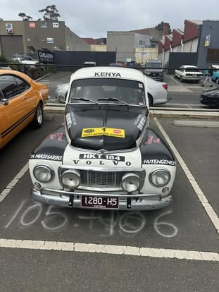 Classic Volvo with rally stickers at Diamond Creek CarFest event.