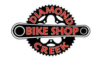 Diamond Creek Bike Shop logo with gear and bike chain design.