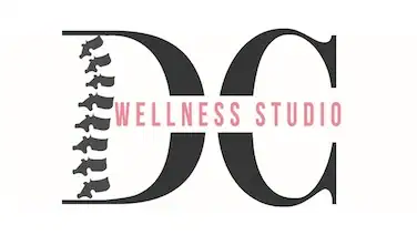 DC Wellness Studio logo with spine graphic and modern design.