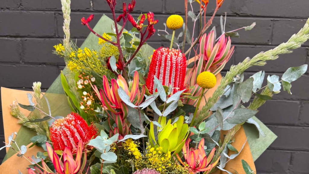 Fresh Christmas flowers being arranged at Rainflorist in Diamond Creek