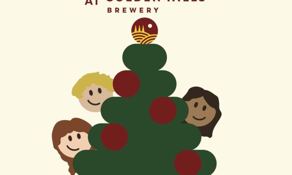 Festive Christmas tree with children at Golden Hills Brewery event.