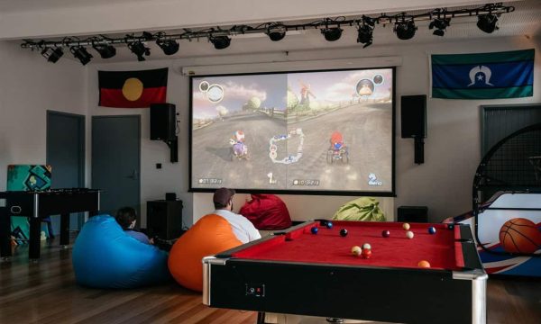 Young people playing video games at the Youth Hub in Diamond Creek Shopping.