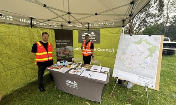 Community safety booth at Diamond Creek Shopping with maps and information.